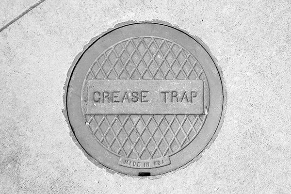 neglecting grease trap pumping can lead to clogs, slow drainage, and even fines for non-compliance with environmental regulations